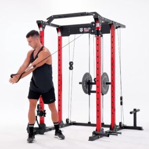 man using the major fitness home gym to perform cross body exercise