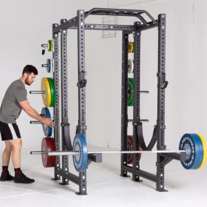 man pulling olympic weight off the rep fitness pr 4000 power rack