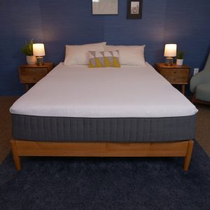 emma hybrid comfort mattress without bedding on a wooden bed frame