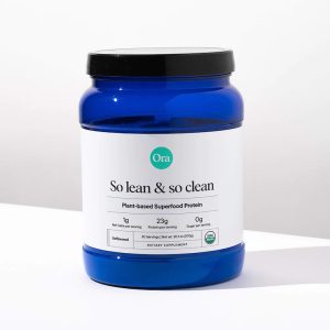 a close-up of a blue, translucent container of Ora Organic's So Lean and So Clean plant-based superfood protein powder