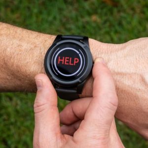 image of hand holding the at-home and on-the-go safe watch active