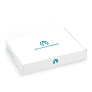 A white box labeled "LetsGetChecked" with teal text and logo, featuring a circular graphic element with concentric circles, placed against a white background.