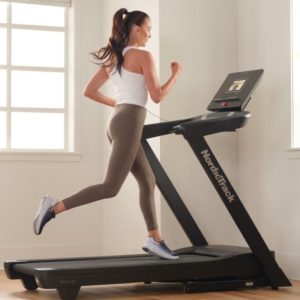 woman is running on treadmill nordictrack exp 7i