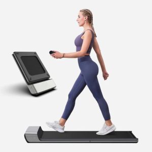 a woman is walking on treadmill p1 foldable walking