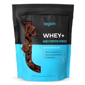 A black and blue pouch of Legion Whey+ Whey Protein Powder in Dutch Chocolate flavor. The label indicates it contains grass-fed whey protein isolate, is naturally sweetened and flavored, and has no added sugars.
