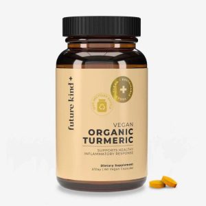 a bottle of future kind organic turmeric on a white background next to tablets
