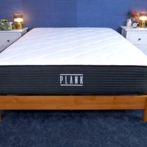 the plank firm mattress in a bedroom with no bedding